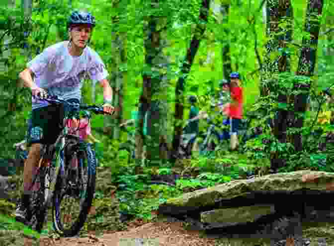 Mountain Biker Navigating A Challenging Trail In The North Carolina Mountains Amazing Asheville: Travel Guide To Asheville And The North Carolina Mountains